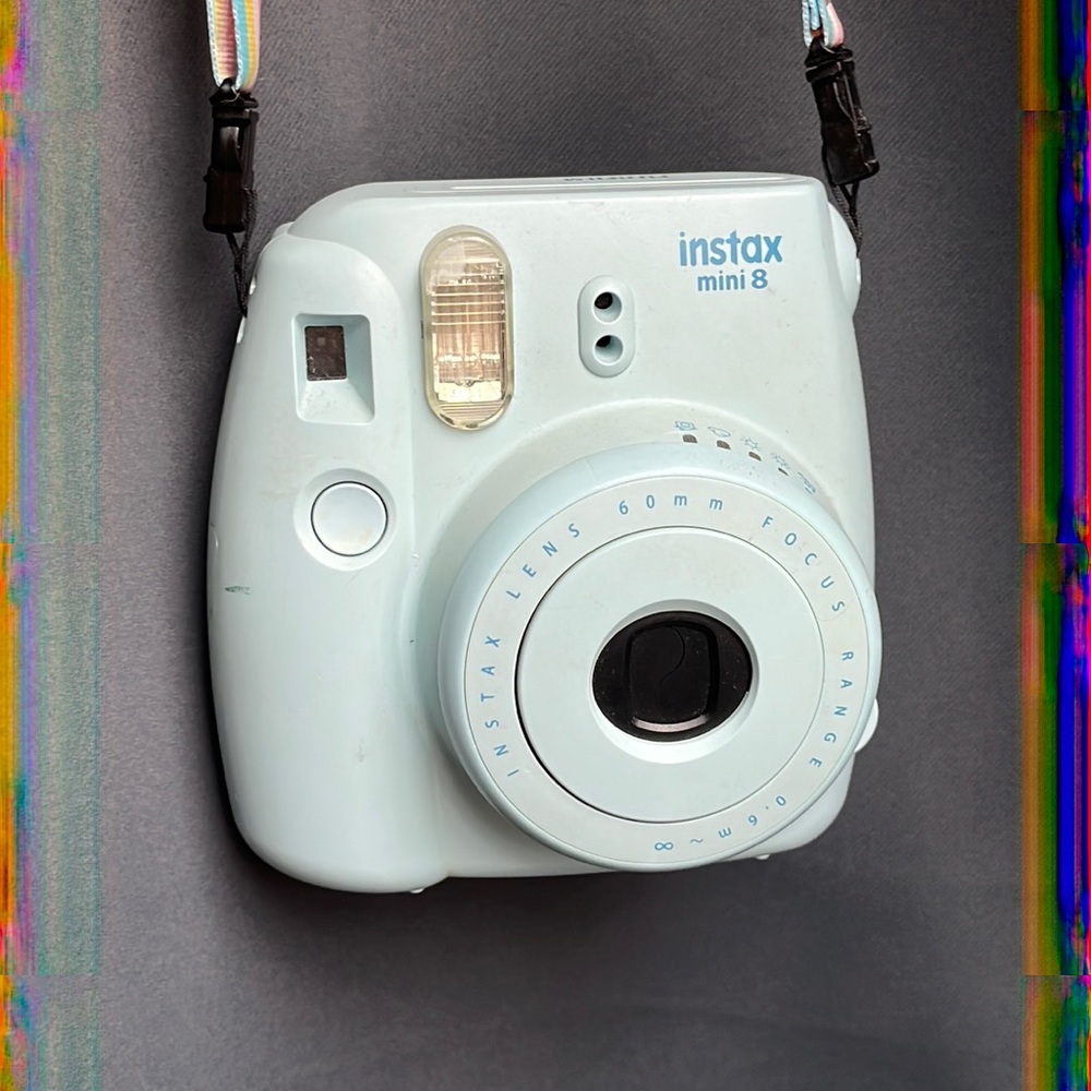 Fujifilm instax mini 8 camera and lanyard